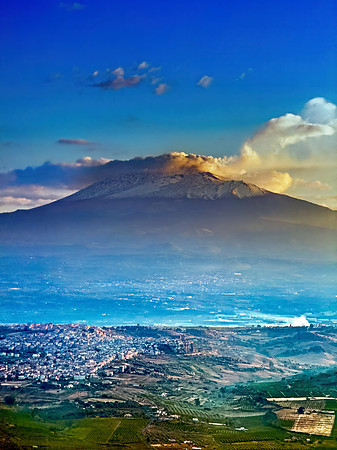 Snowcapped Mt. Etna: Majestic Volcanic Peak Over Motta Sant' Ana